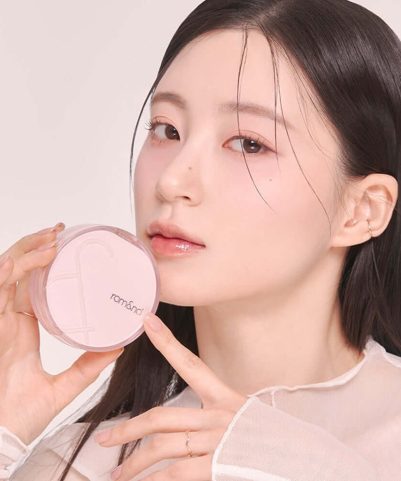 Woman holding ROMAND Bloom in Coverfit Cushion
