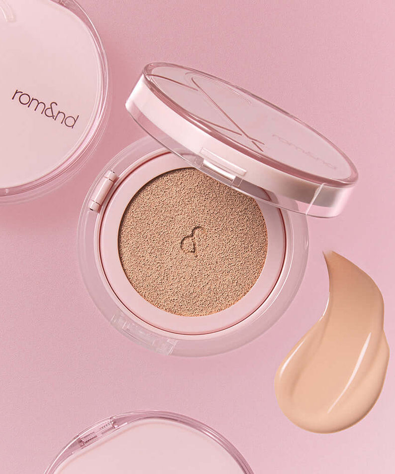 ROMAND Bloom in Coverfit Cushion on a pink background with foundation swatch