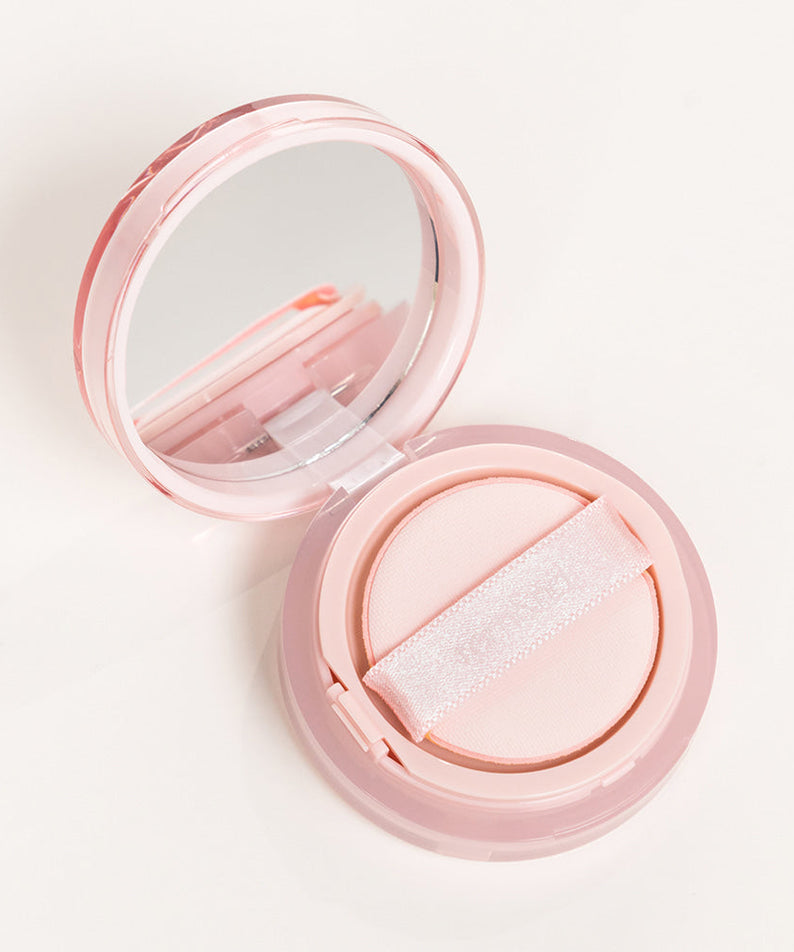 ROMAND Bloom in Coverfit Cushion mini compact with pink case and mirror, perfect for flawless makeup application.