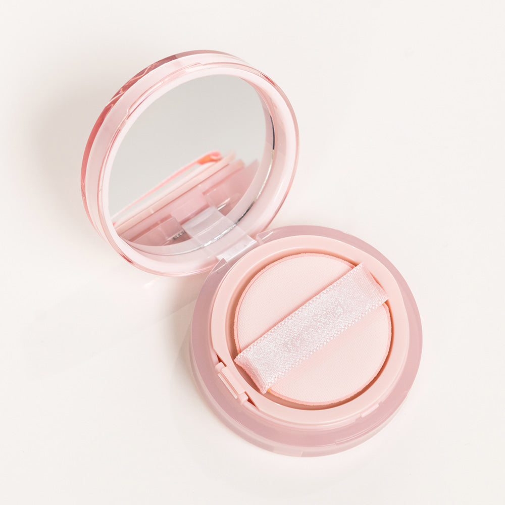 ROMAND Bloom in Coverfit Cushion mini compact with pink case and mirror, perfect for flawless makeup application.