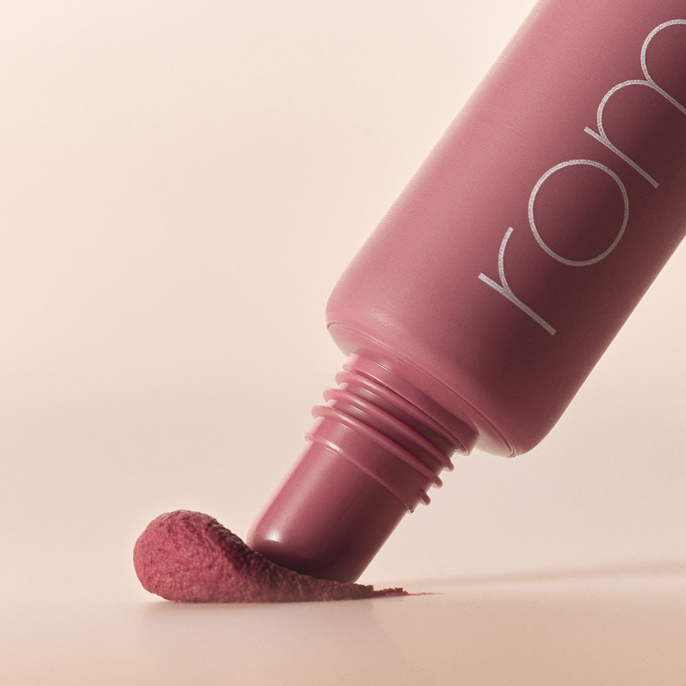 ROMAND Color Lip Matte in a sleek pink tube with color swatch, showcasing vibrant matte finish.