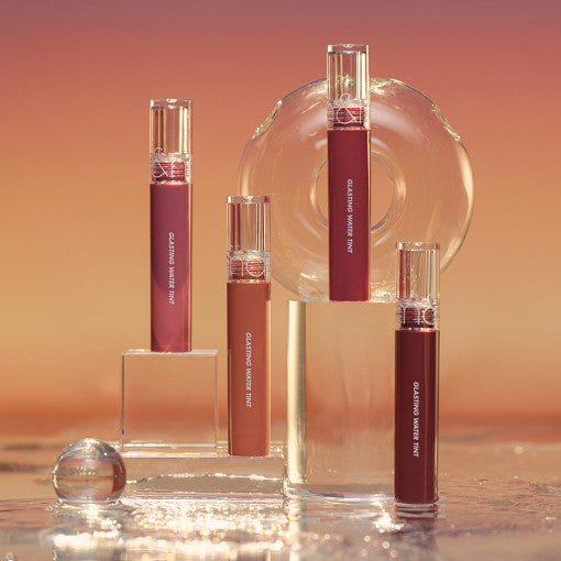 ROMAND Glasting Water Tint (#02 to #17) in various colors displayed against a sunset background.