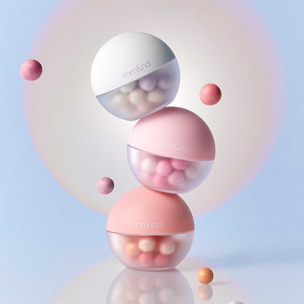 ROMAND Sheer bead powder #KodakMADE in elegant pastel containers with floating beads, creating a light and airy aesthetic.