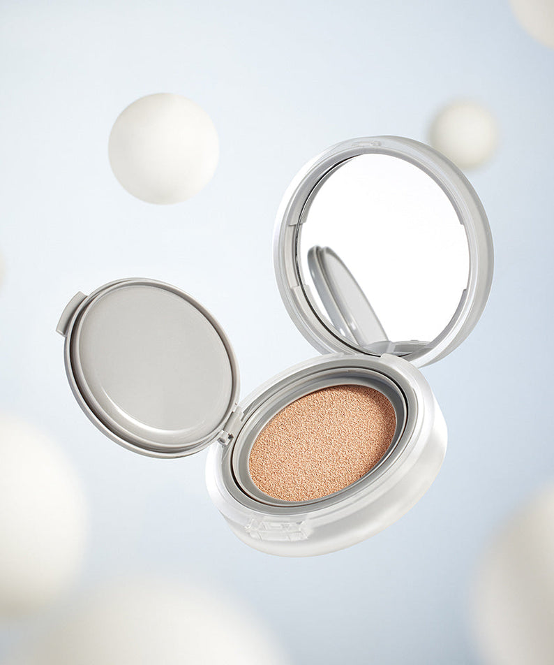ROMAND nu zero cushion in an open compact against a soft, dreamy background.