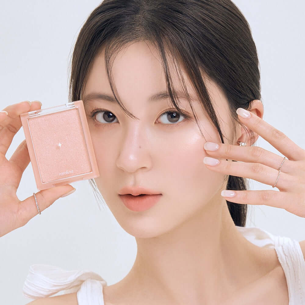 Model showcasing ROMAND see-through veil lighter makeup product close-up