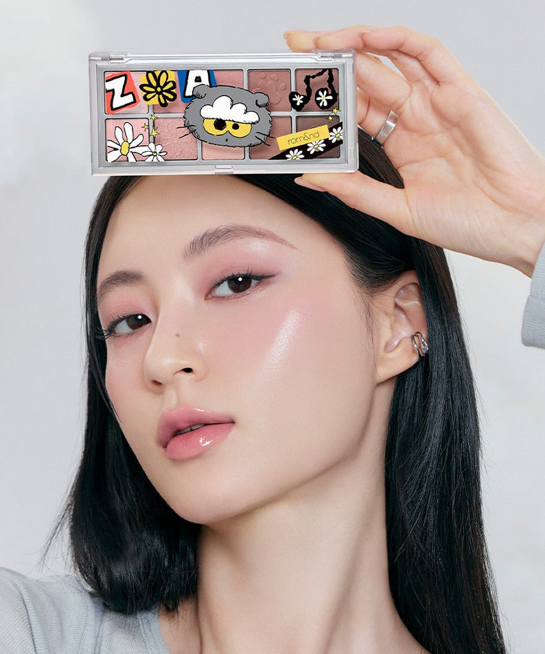 Woman holding ROMAND x Joanne Friends Better Than Palette showcasing eyeshadow colors