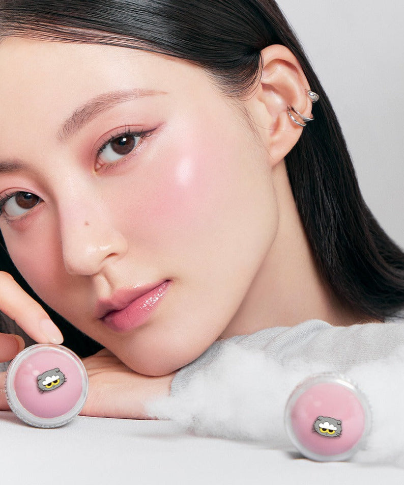 Model showcasing ROMAND x Joanne Friends Juicy R Cheek (Special Set) with pink blush and stylish earrings.