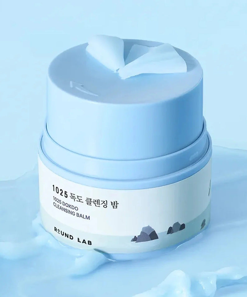 ROUND LAB 1025 Dokdo Cleansing Balm 50ml in blue jar on a soft background