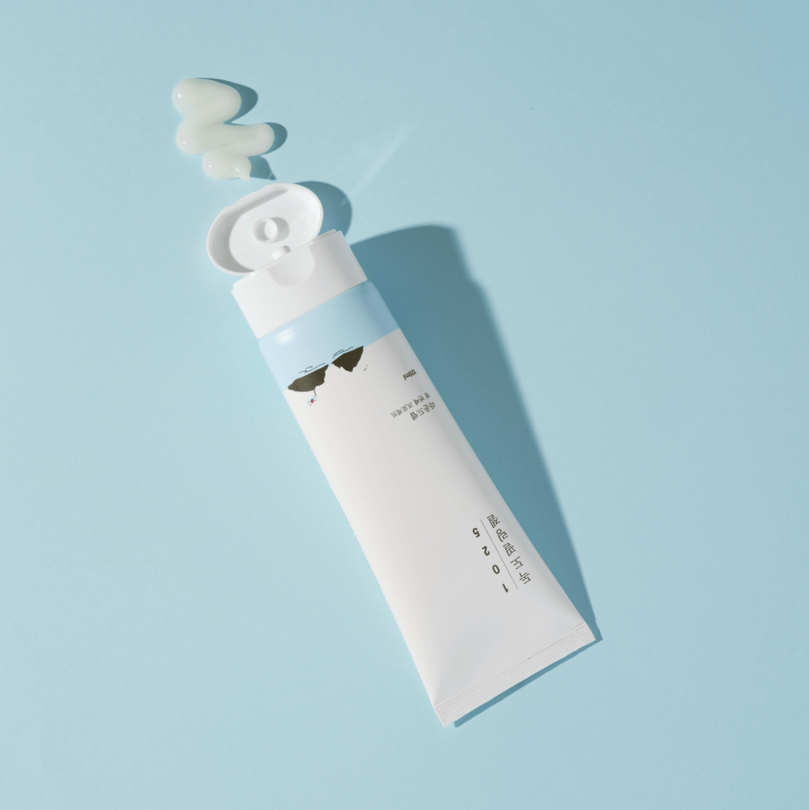 ROUND LAB 1025 Dokdo Peeling Gel 120ml tube with gel on blue background
