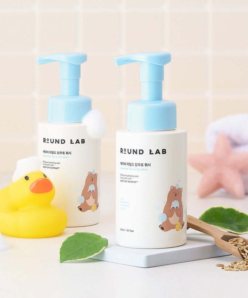 ROUND LAB Baby Mild Top To Toe Wash 300ml bottles displayed with a rubber duck and starfish.
