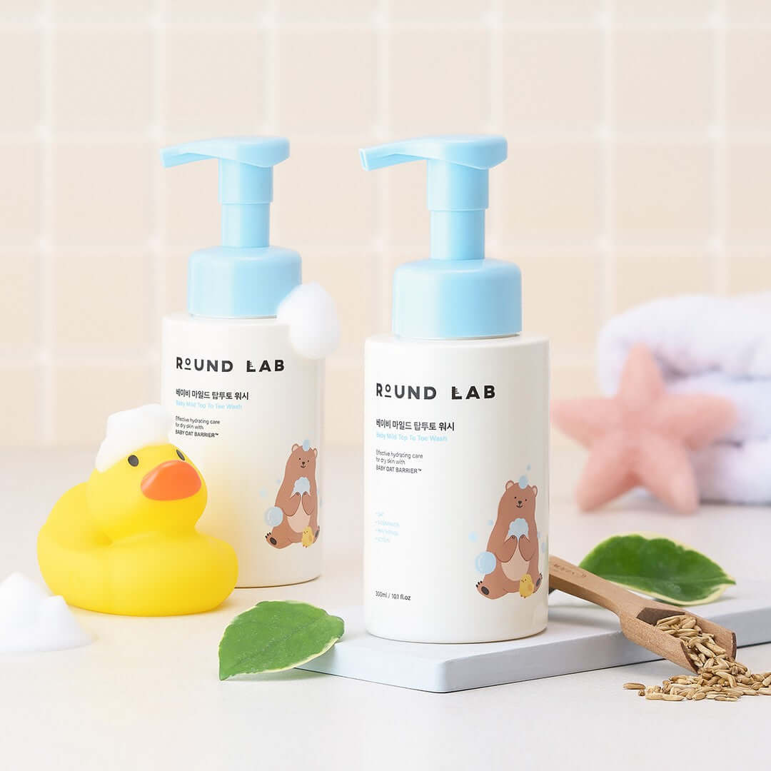 ROUND LAB Baby Mild Top To Toe Wash 300ml bottles displayed with a rubber duck and starfish.