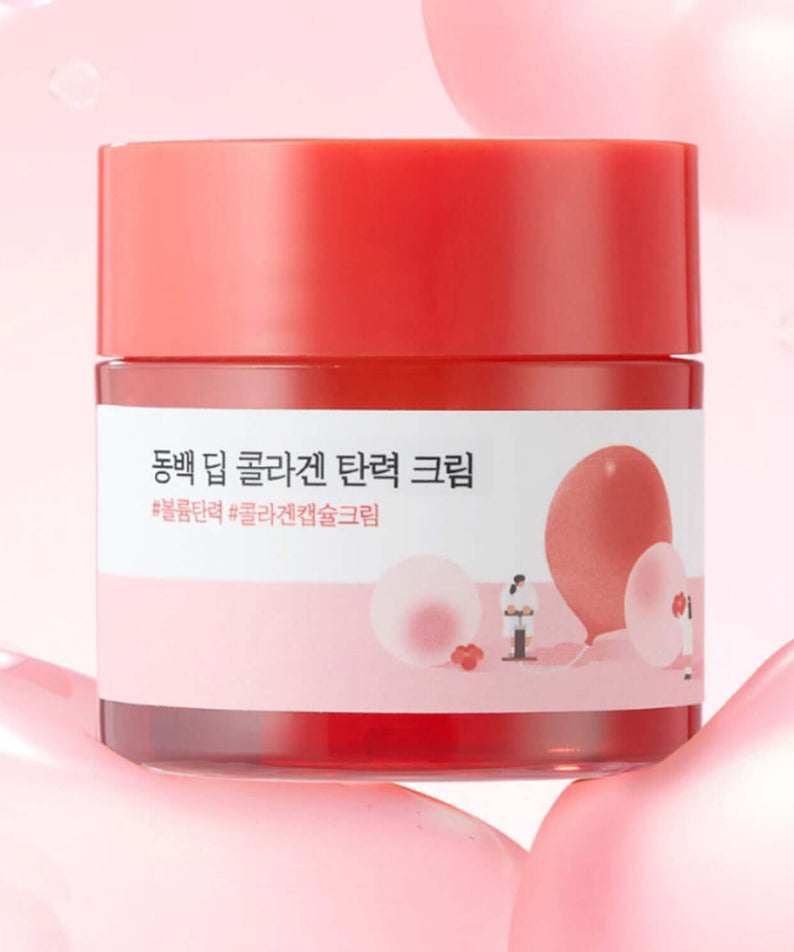 Jar of ROUND LAB Dongbaek Deep Collagen Elasticity Cream 50ml with pink background and floral design