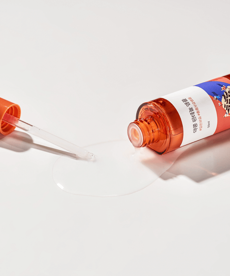 ROUND LAB Pine Calming Cica Ampoule 30ml bottle with dropper on a white background, highlighting the ampoule's calming properties.