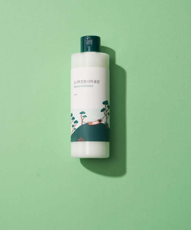 Image of ROUND LAB Pine Calming Cica Lotion 250ml on a green background