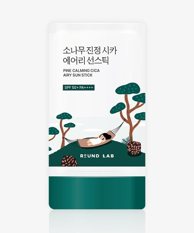 Packaging of ROUND LAB Pine Soothing Cica Airy Sun Stick 19g with illustration of a person relaxing in a hammock among pine trees.