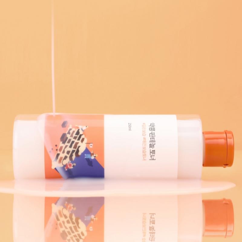 ROUND LAB Yakkong Panthenol Toner 250ml on a reflective surface with peach background