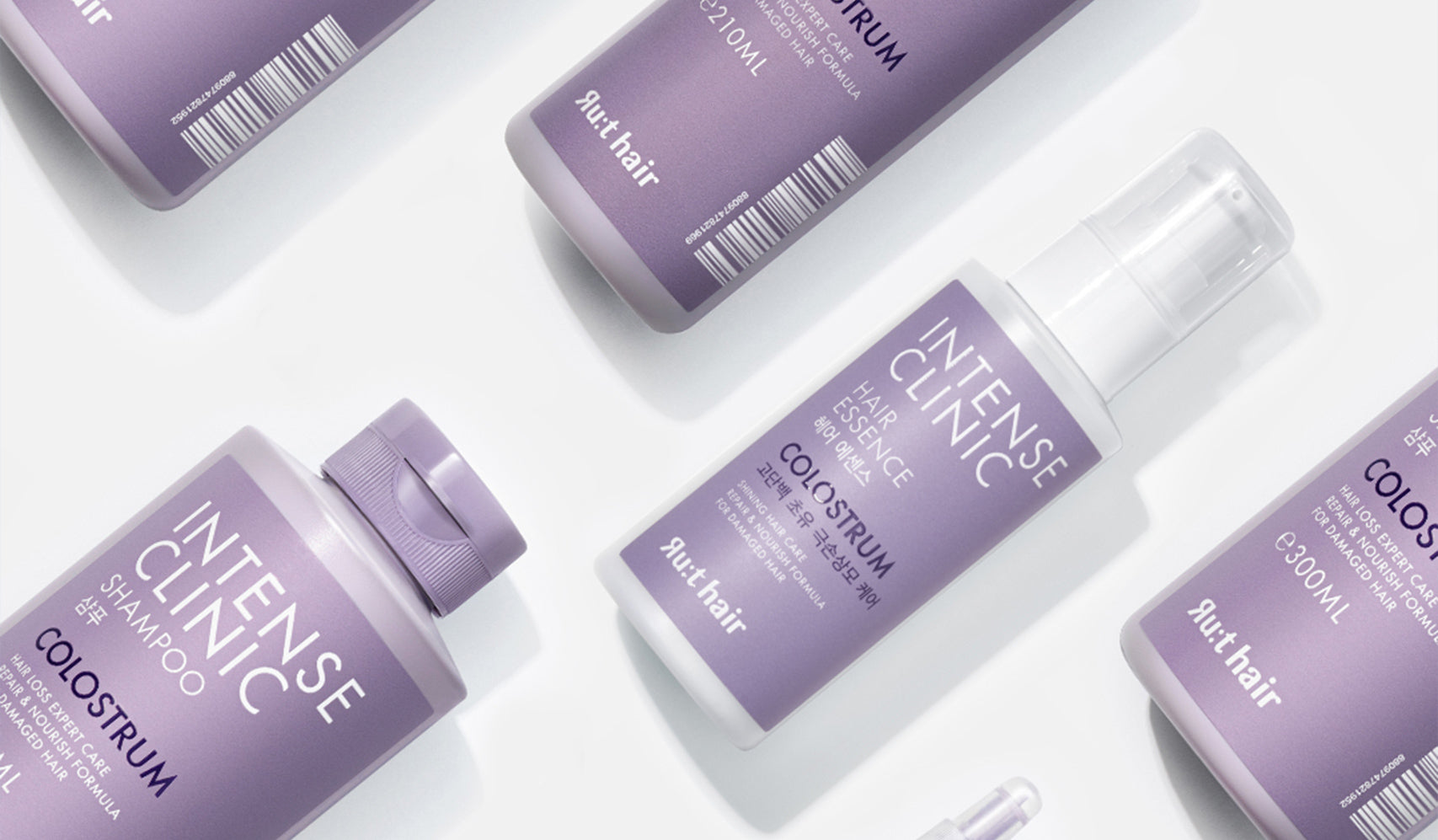 Intense Clinic hair care products featuring colostrum shampoo and serum bottles on a white background.