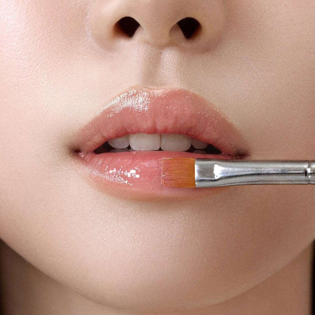 Close-up of lips with RULIDIA Shining Moment Caring Lip Balm 8g being applied, showcasing glossy finish and moisturizing effect.