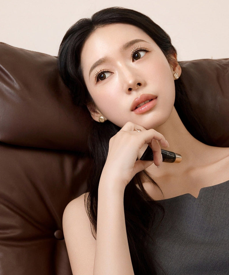 Woman applying RULIDIA Shining Moment Caring Lip Balm 8g