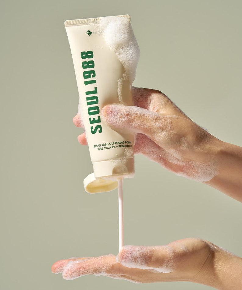 Person using SEOUL 1988 Pine Cica Cleansing Foam with rich lather for gentle skin cleansing.