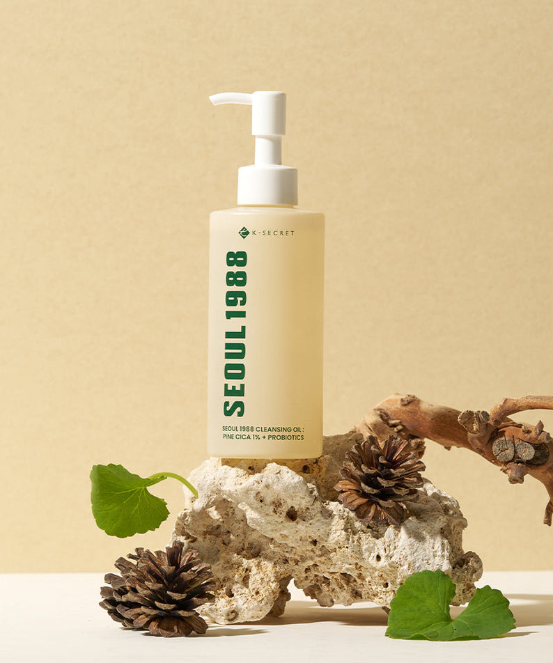 SEOUL 1988 Pine Cica Cleansing Oil bottle on natural stone surface with pine cones and leaves
