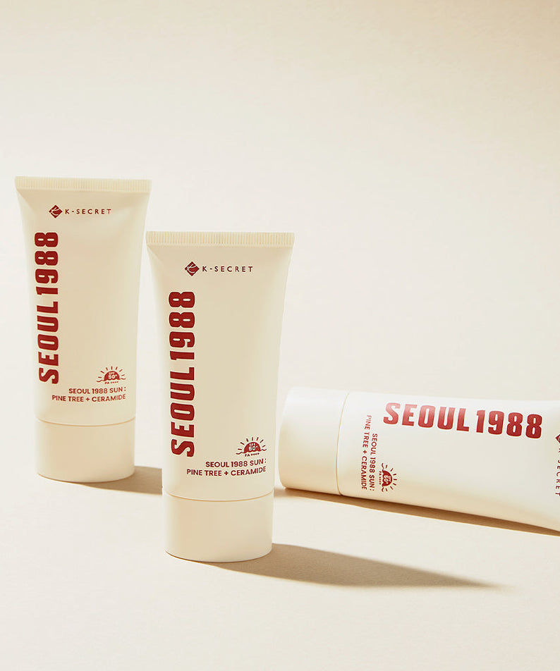 SEOUL 1988 Pine Sunscreen tubes on a beige background