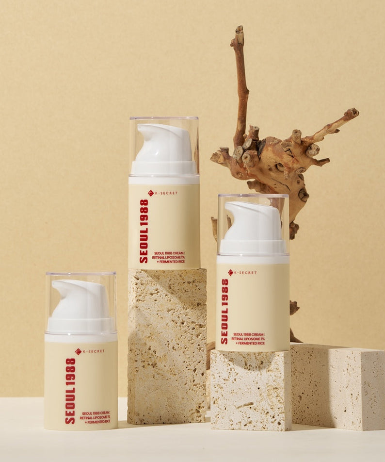 SEOUL 1988 Retinal Fermented Rice Cream bottles on stone blocks with natural wood backdrop