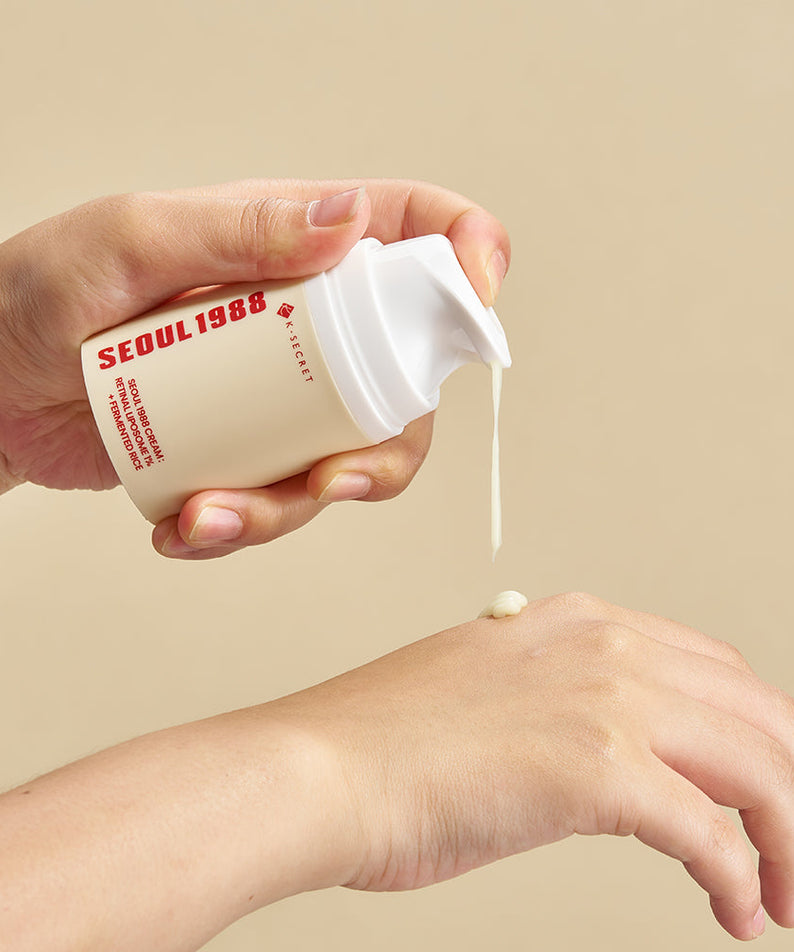Applying SEOUL 1988 Retinal Fermented Rice Cream on hand for skincare