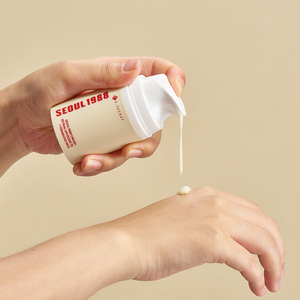 Applying SEOUL 1988 Retinal Fermented Rice Cream on hand for skincare