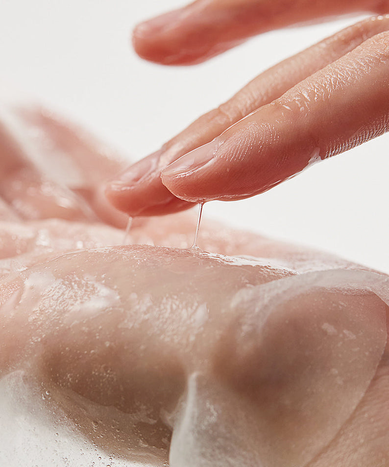 Applying SHAISHAISHAI [10+10]Aloe PDRN Cooling Gel Pads Mask 10 Sheets on skin for soothing effect.