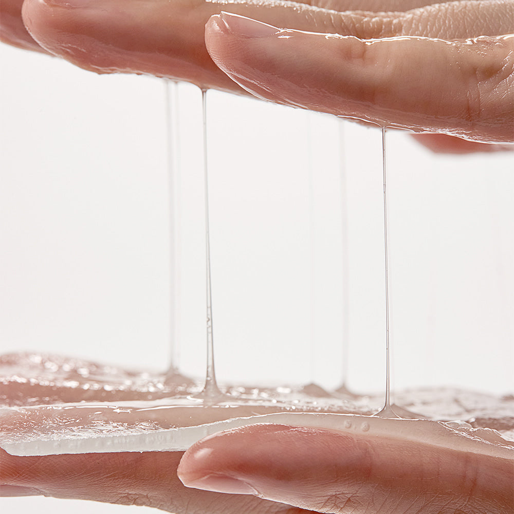 SHAISHAISHAI [10+10]Aloe PDRN Cooling Gel Pads Mask 10 Sheets texture demonstration with gel stretching between hands.