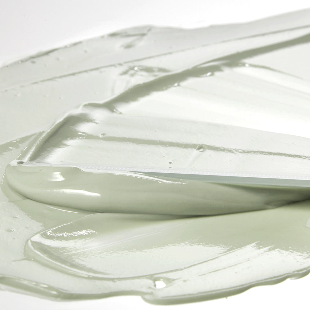 Texture of SHAISHAISHAI [1+1]Aloe PDRN Cooling Mud Mask 100ml cream spread with a spatula, showing smooth and creamy consistency.