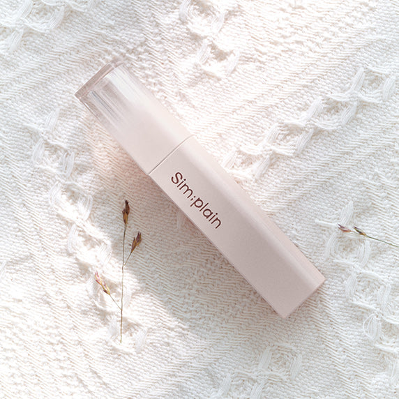 SIM;PLAIN Dewy Volume moisturizing serum on lace fabric