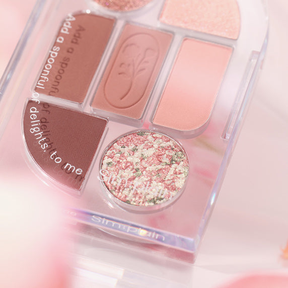 Close-up of SIM;PLAIN Eye Palette showcasing diverse shades and textures, perfect for versatile makeup looks.