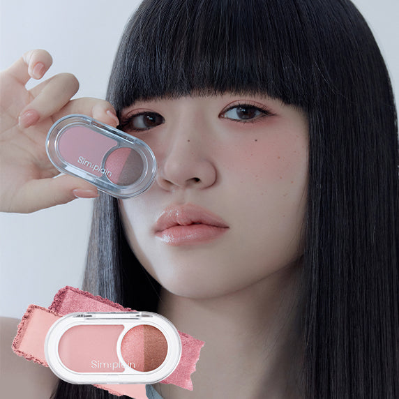 Person holding SIM;PLAIN Gleam On Eyes makeup palette over eye with close-up of product colors.