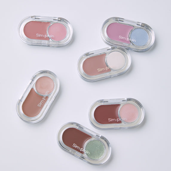 Various shades of SIM;PLAIN Glim on the night eyeshadow palettes arranged on a white background.