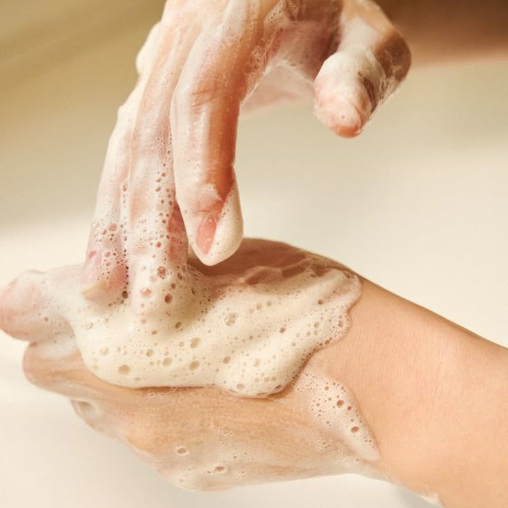 SKIN1004 Madagascar Centella Ampoule Foam 125ml forming a rich lather during skincare routine.