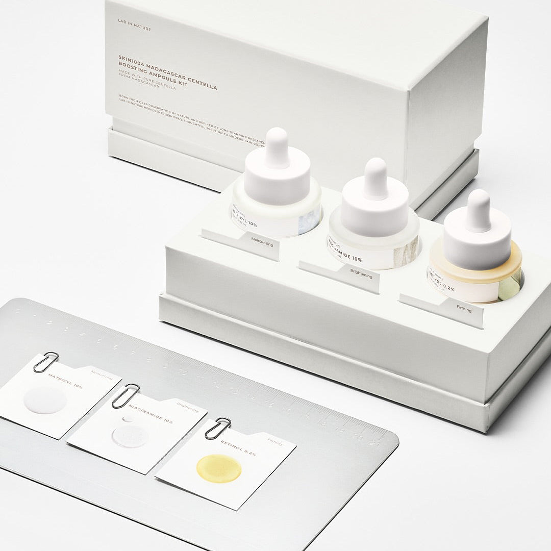 SKIN1004 Madagascar Centella Boosting Ampoule Kit displayed in a white packaging with sample sachets.