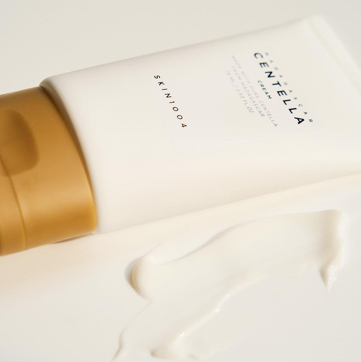SKIN1004 Madagascar Centella Cream 75ml tube with cream swatch on white surface