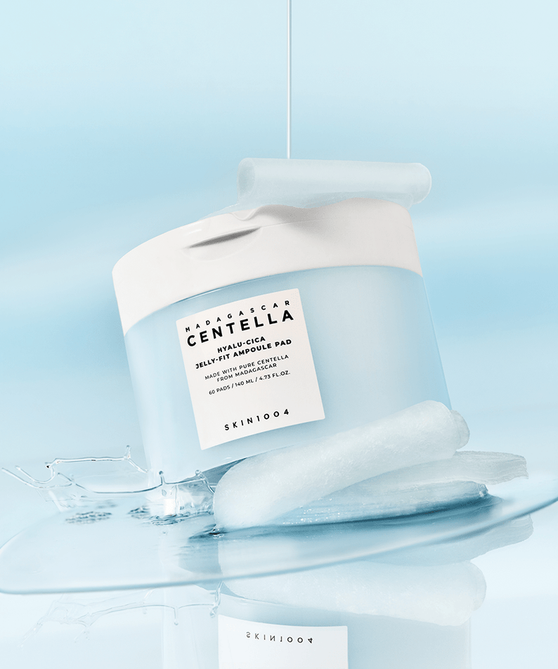 SKIN1004 Madagascar Centella-Hyalu-Cica Jelly Fit Ampoule Pads (60 sheets) displayed on a glossy surface with ice cubes