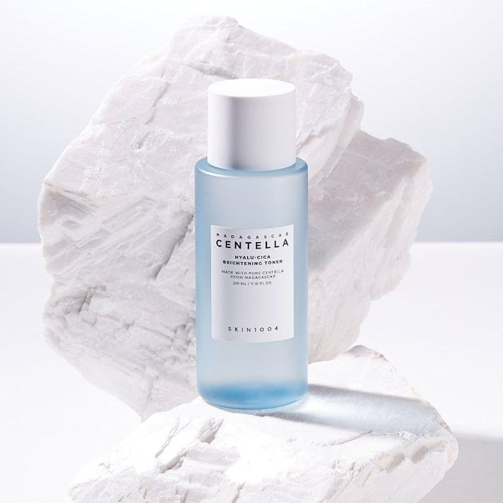 SKIN1004 Madagascar Centella Hyalu-Cica Radiance Toner 210ml bottle on white textured background