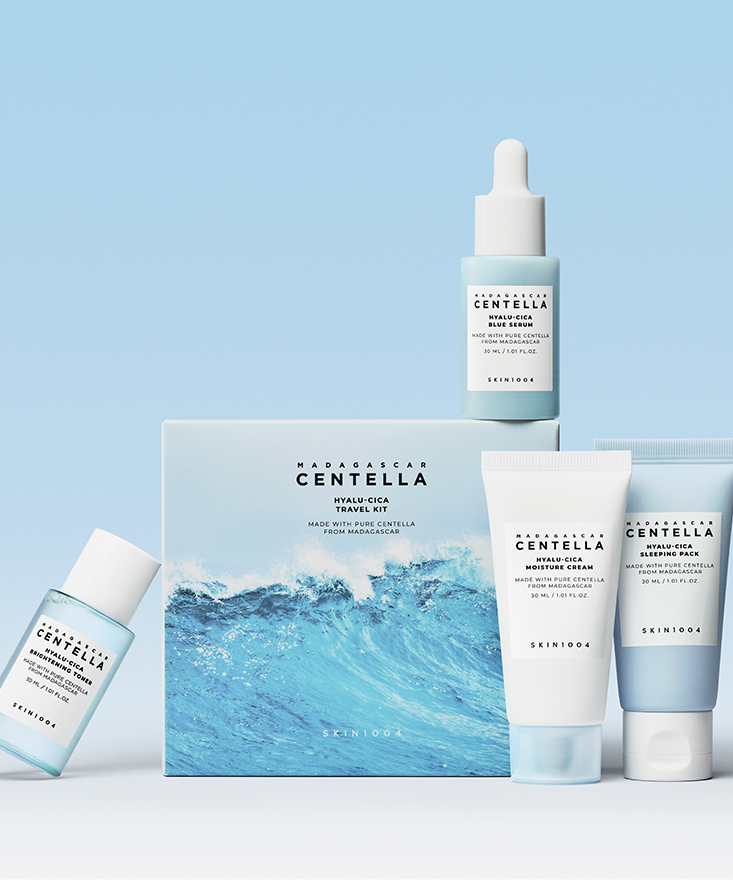 SKIN1004 Madagascar Centella Hyaluronic Acid Travel Kit with four skincare products on a blue background.
