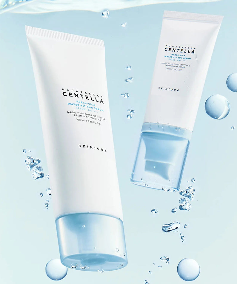 SKIN1004 Madagascar Centella Hyaluronic Acid Water-Fit Sun Serum 100ml with hydrating droplets and light blue background