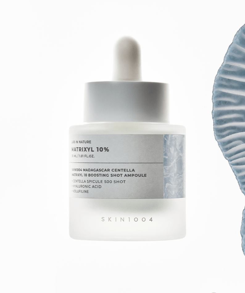 SKIN1004 Madagascar Centella Matrixyl 10 Boosting Shot Ampoule 30ml bottle with blue abstract design.