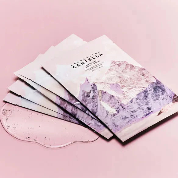 SKIN1004 Madagascar Centella Pore-Melting Clarifying Mask 23ml [5 sheets] on a pink surface