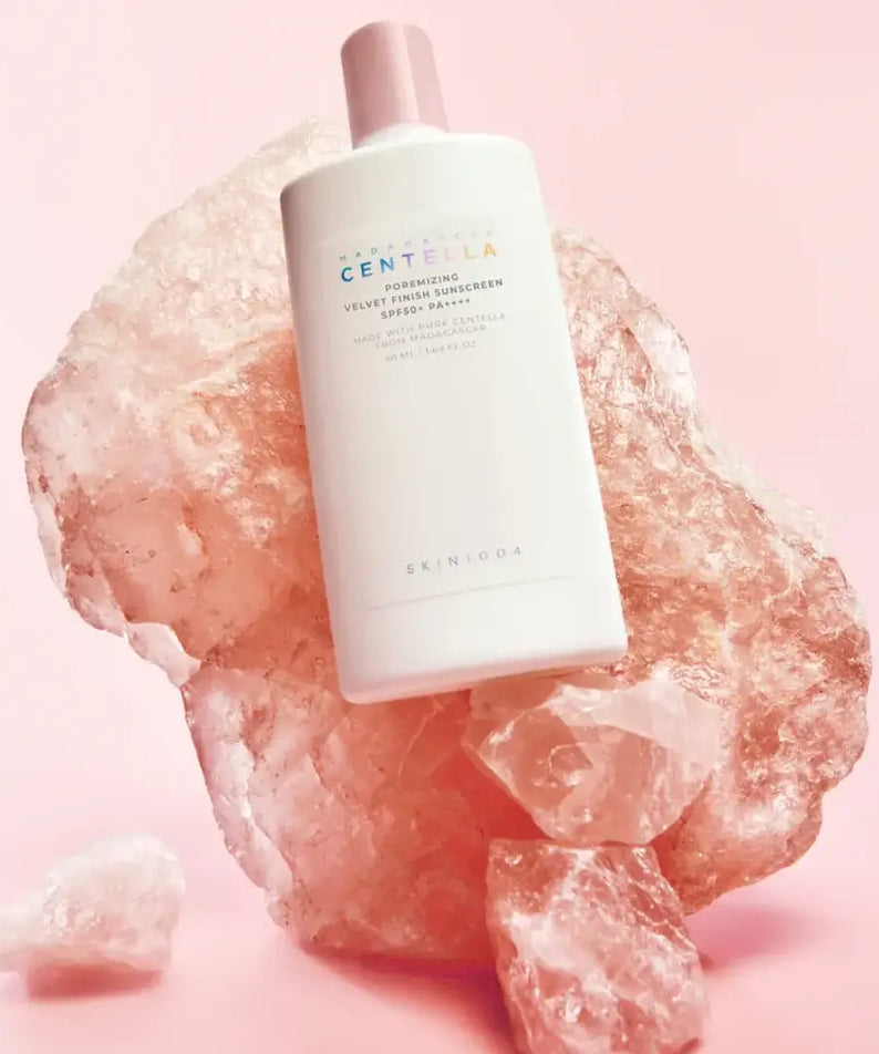 SKIN1004 Madagascar Centella Poreizing Velvet Finish Sunscreen 50ml on pink rock background