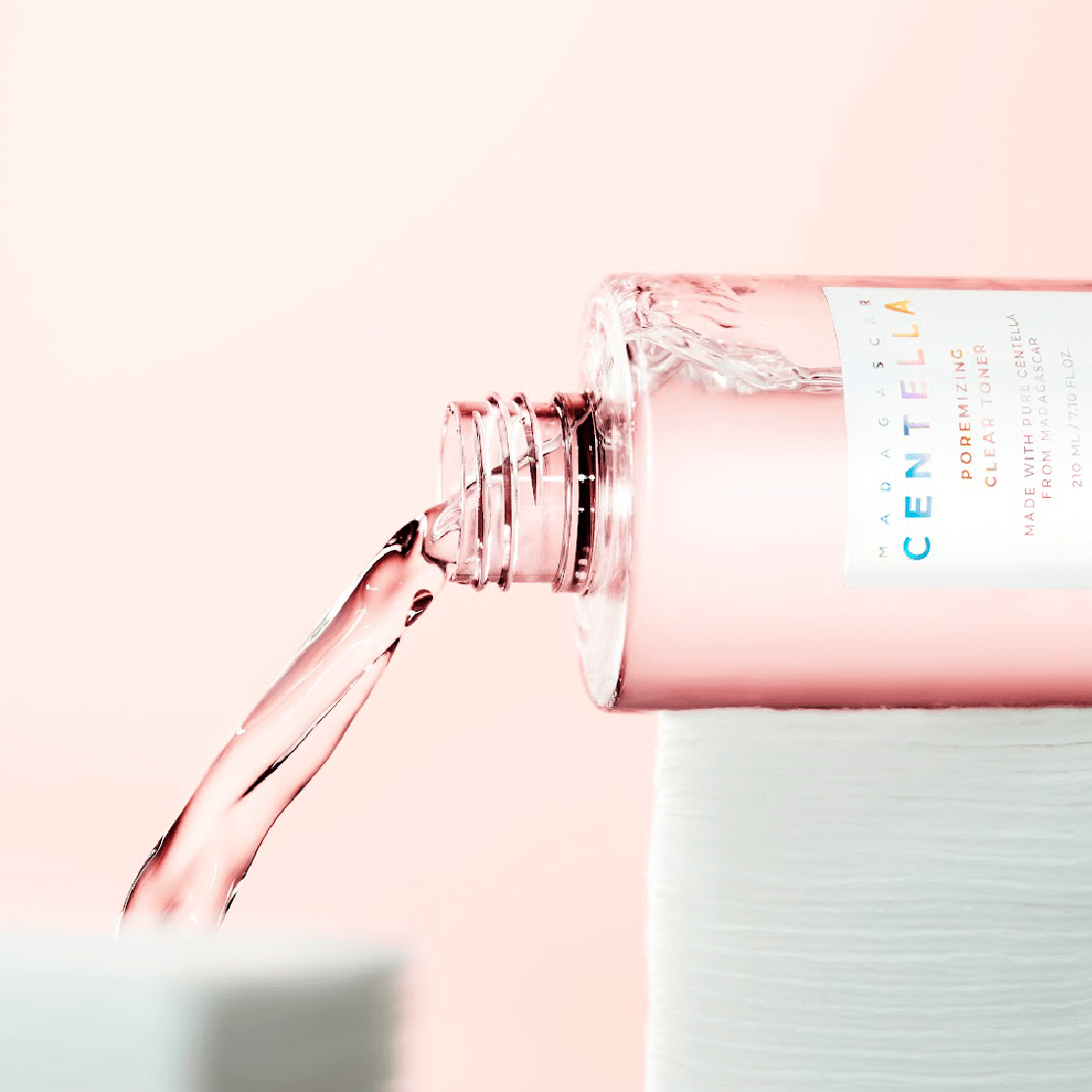 SKIN1004 Madagascar Centella Poremizing Clear Toner 210ml being poured from bottle