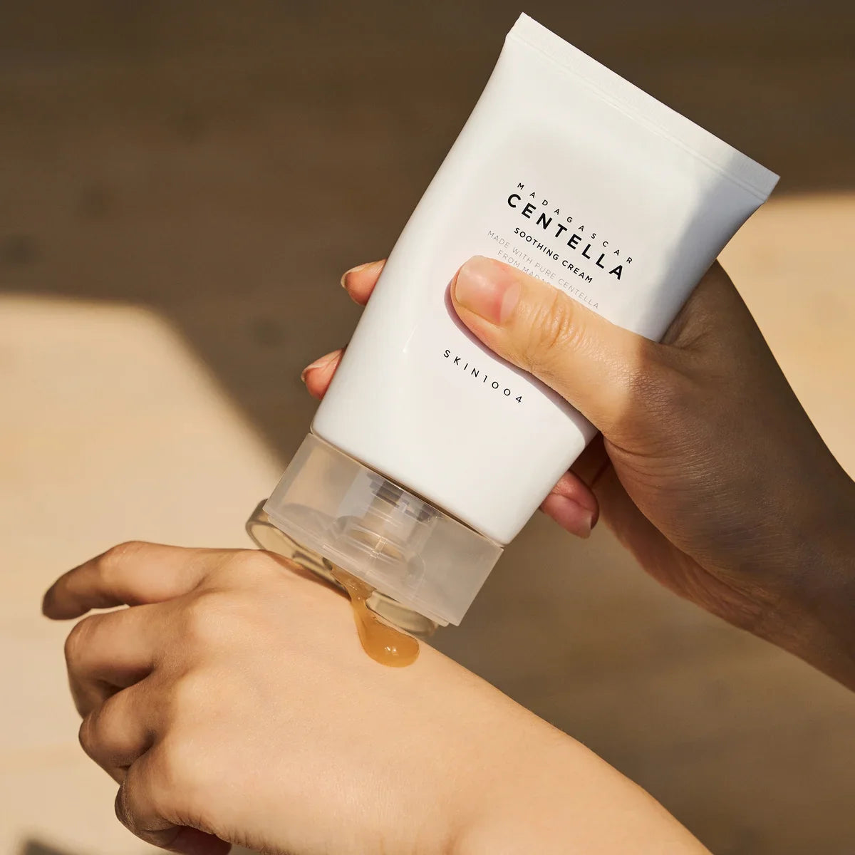 Person applying SKIN1004 Madagascar Centella Soothing Cream 75ml on hand