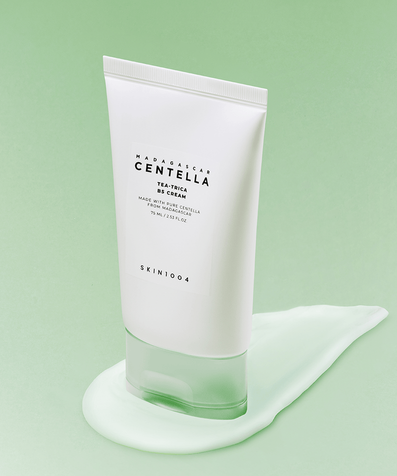SKIN1004 Madagascar Centella Tea-trica B5 Cream 75ml tube on a green background with cream smear underneath