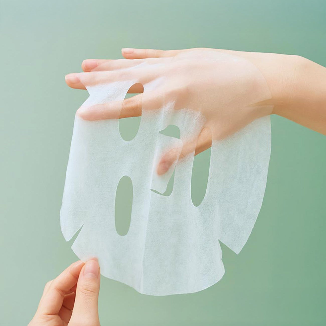 Sheet mask from SKIN1004 Madagascar Centella Tea-trica Relaxing Mask 24ml [5 sheets], shown on hand